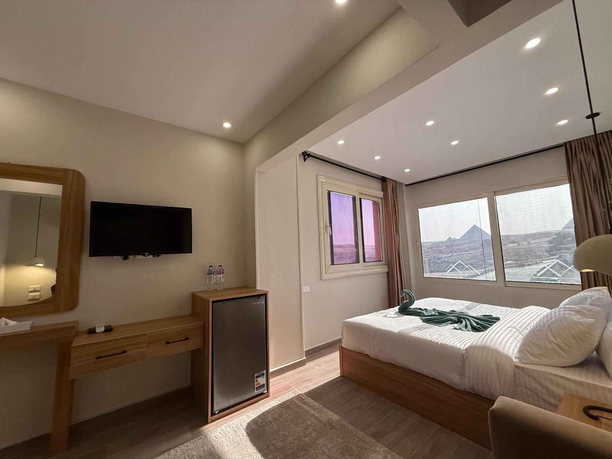 The Gate Hotel Front Pyramids & Sphinx View Kafrat al Jabal Exterior photo
