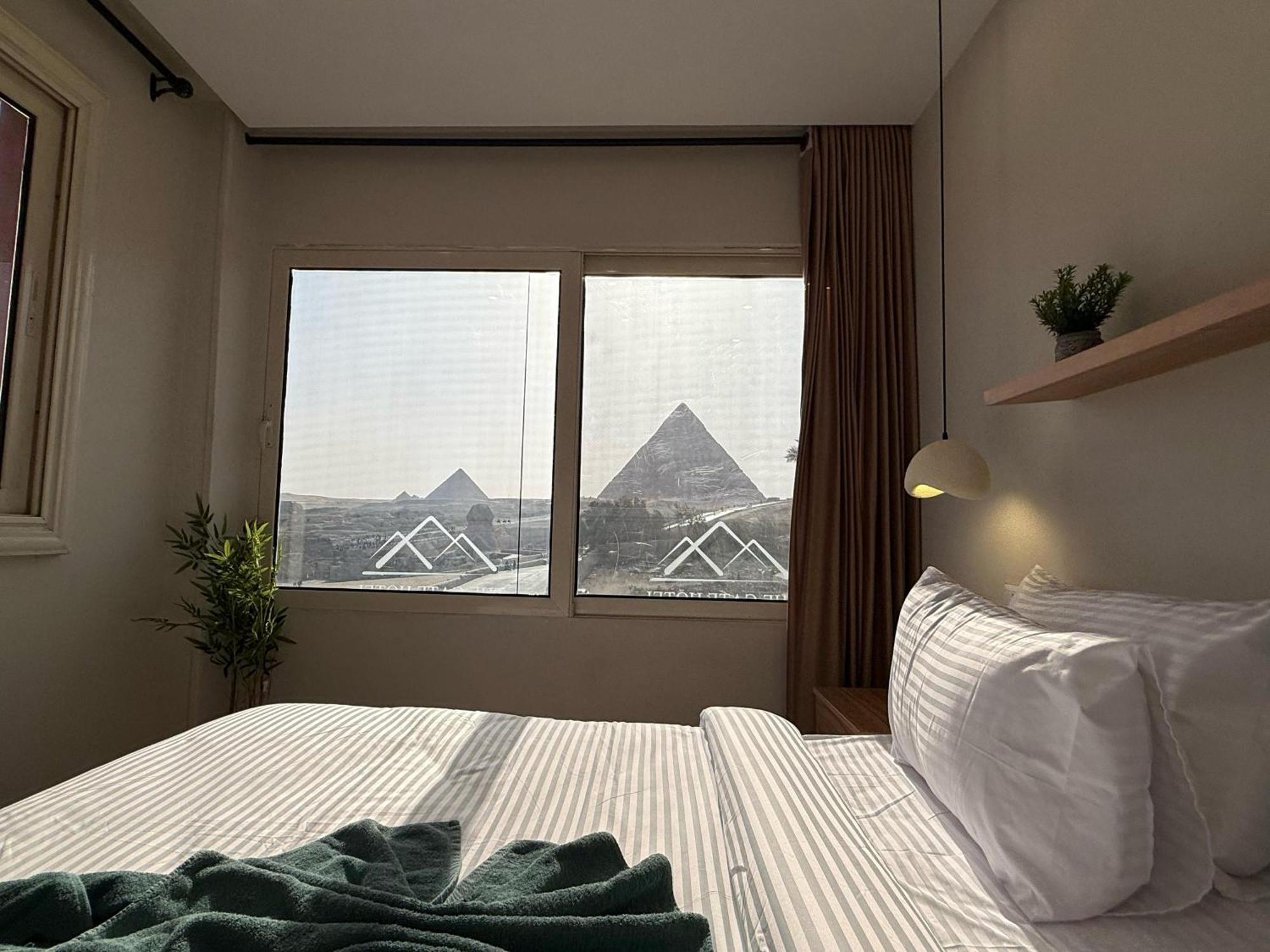The Gate Hotel Front Pyramids & Sphinx View Kafrat al Jabal Exterior photo